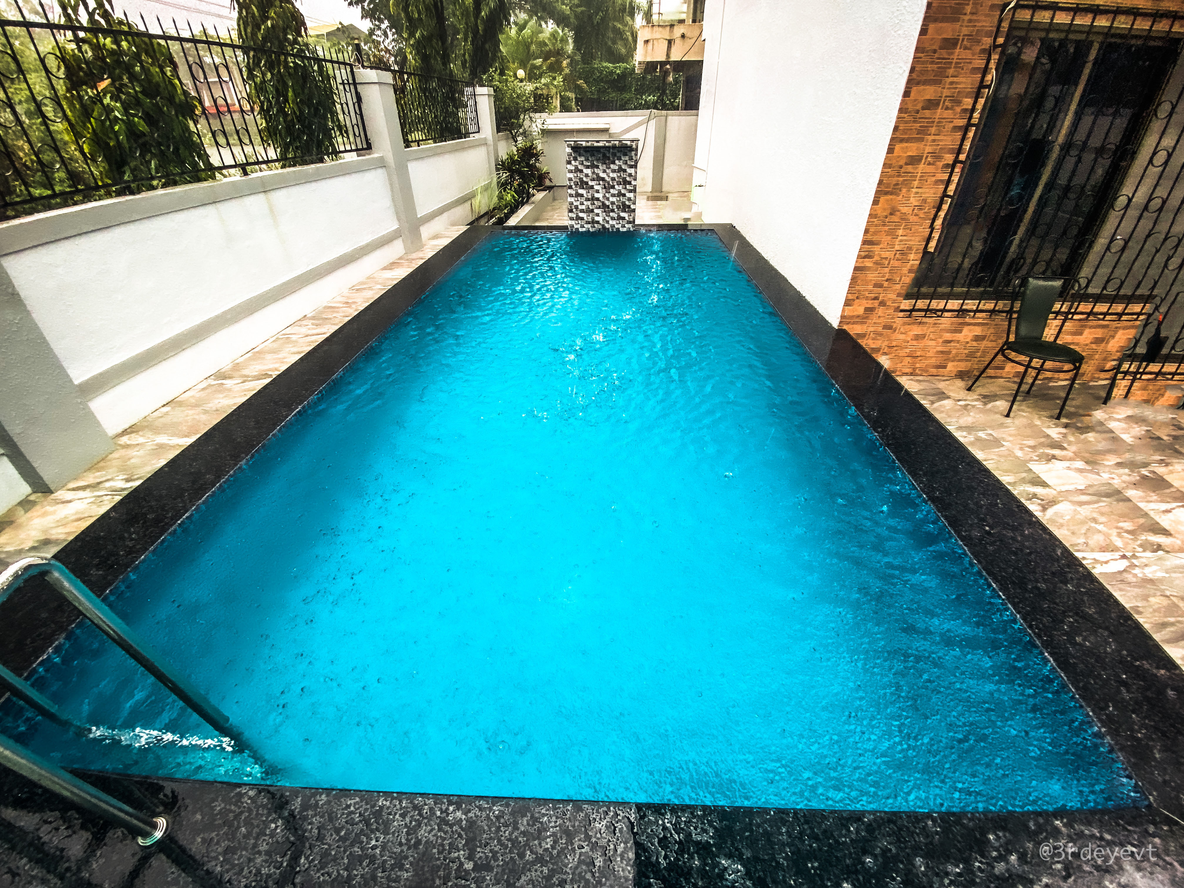 Clear blue water in the villa's private swimming pool